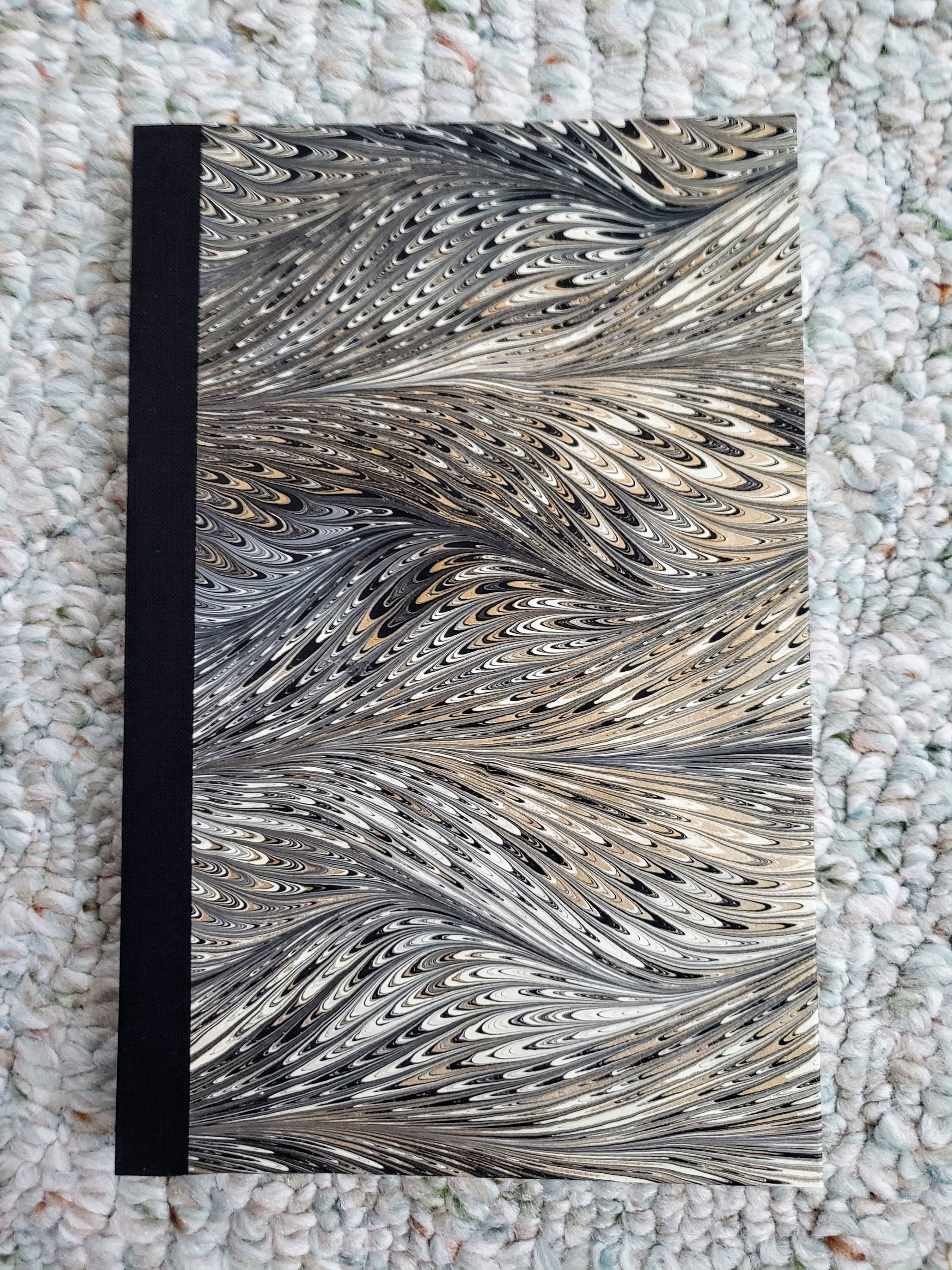 Hand-marbled sewn boards binding